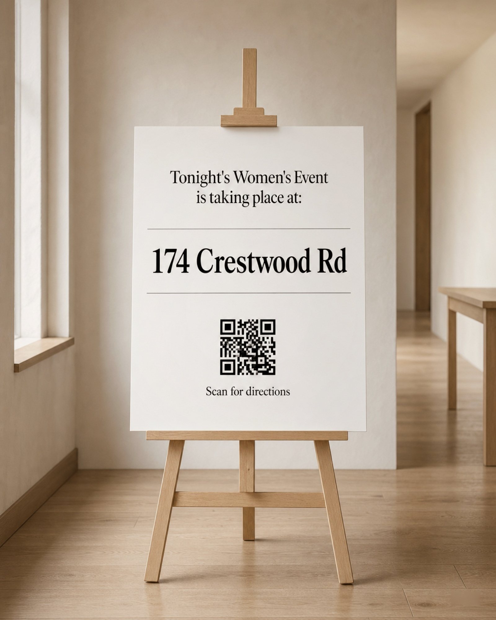 A simple direction sign for the women's event — 174 Crestwood Road, with a QR code for anyone who needs the map.