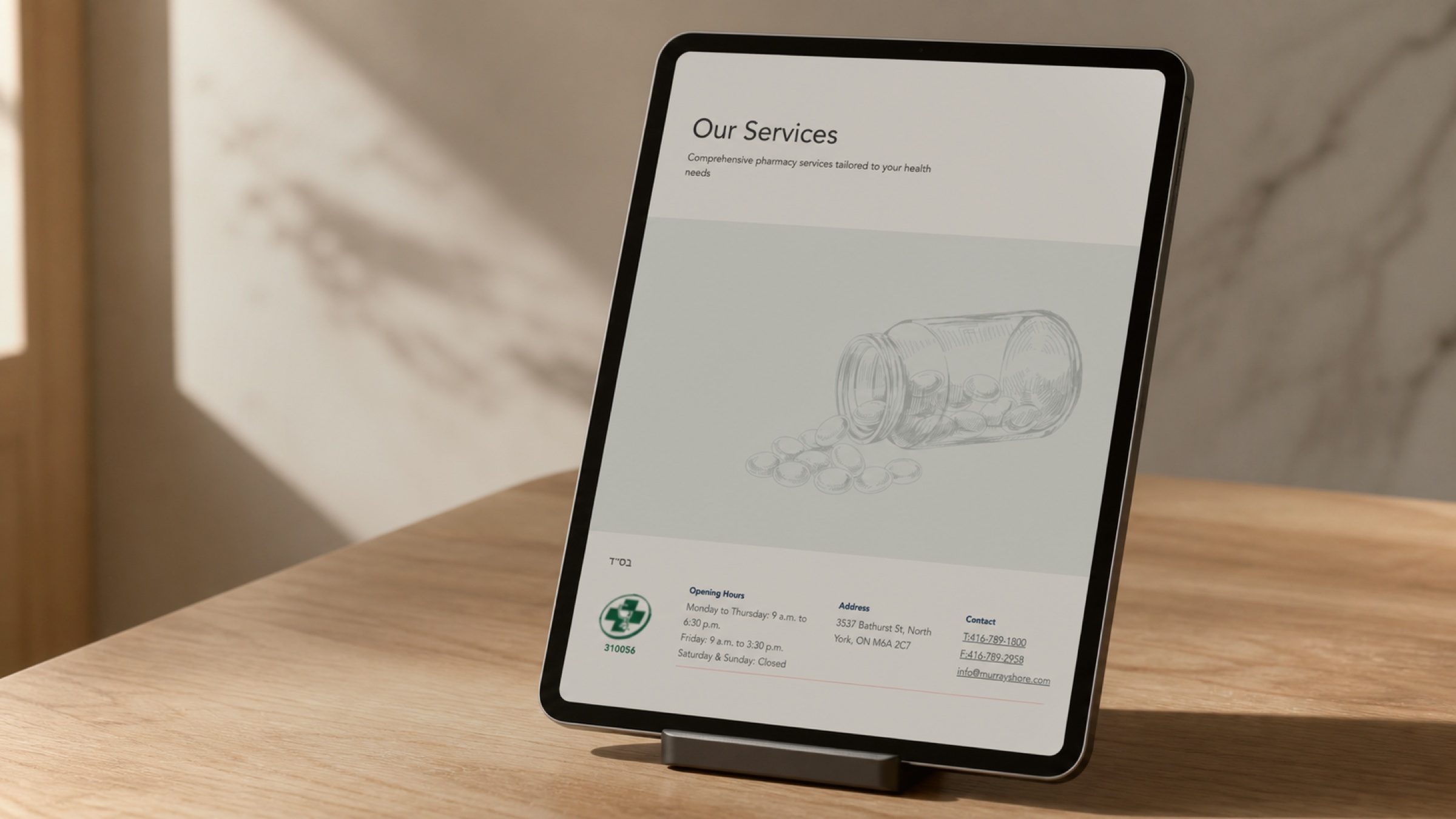 Further down the same page — hours, the college registration number, and a way to reach the pharmacy without picking up the phone.