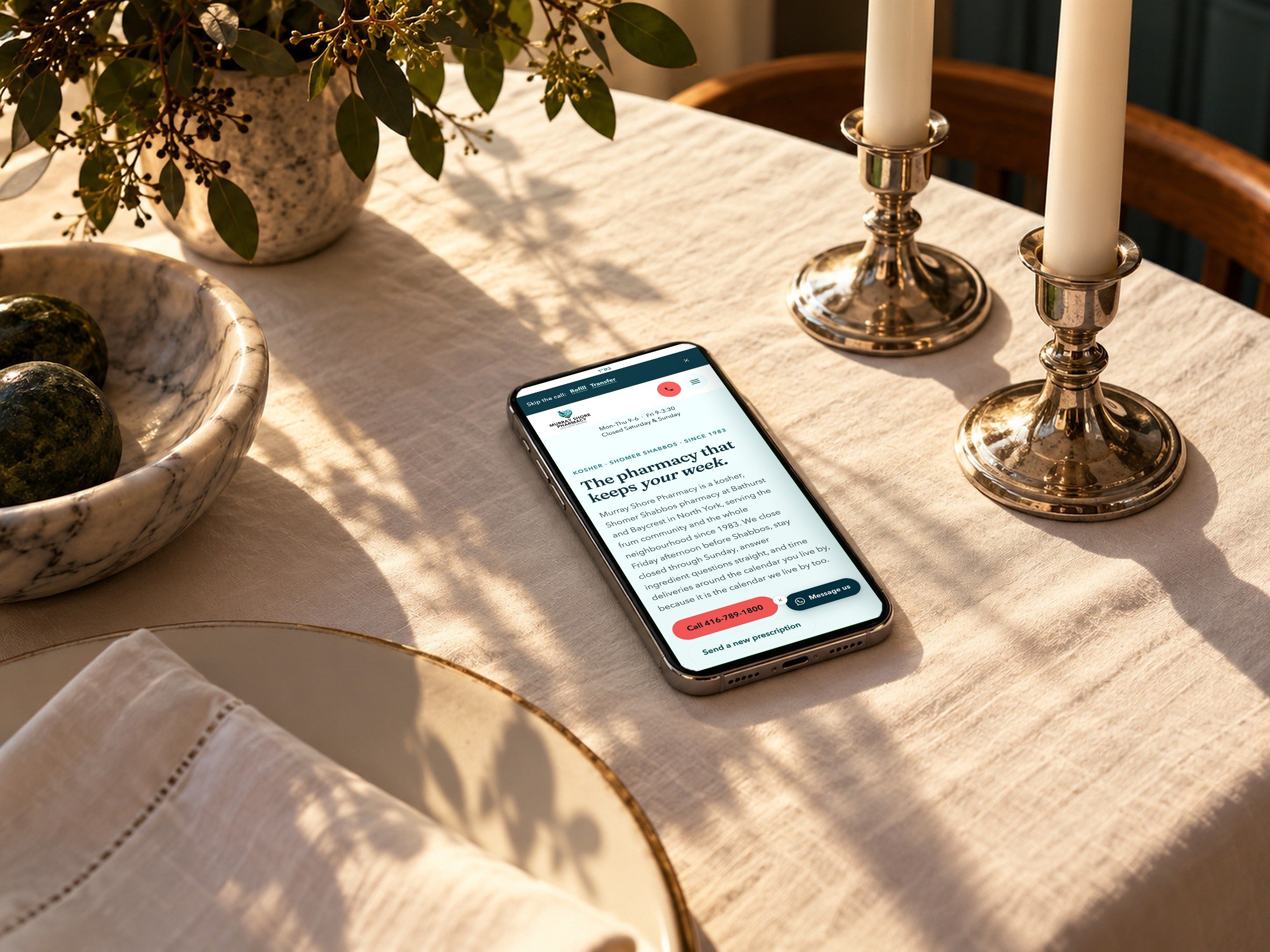 The kosher and Shomer Shabbos page on a phone on a Friday afternoon table.